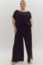 Entro Black ribbed textured knit pants with cream trim