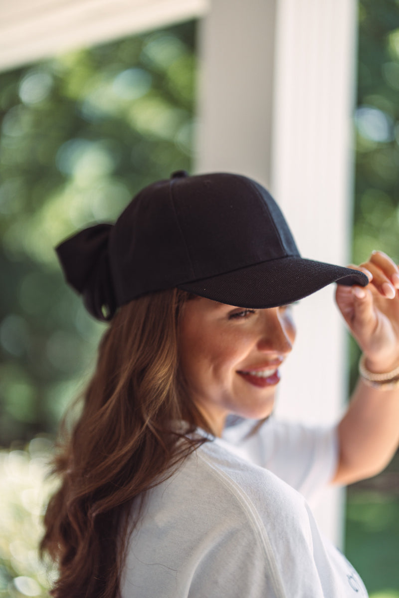 women's black bow back trucker hat