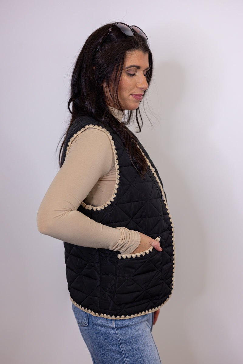 women's black quilted tan trim vest