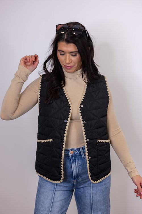 women's black quilted tan trim vest