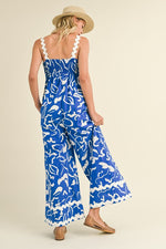 &merci Blue and white abstract print wide leg jumpsuit with scalloped ric rac trim