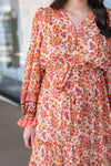 rust orange printed long sleeve midi dress