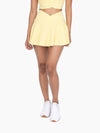 Mono B GREEN criss cross front active tennis skirt lined with shorts in lemon yellow