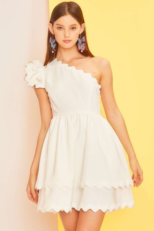 Main Strip Off white one shoulder dress with off white scalloped piping trim