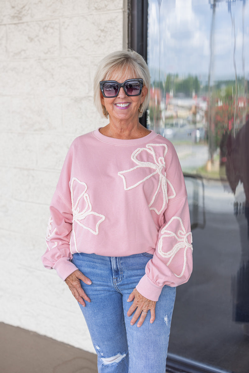 pink white stitched bow sweatshirt