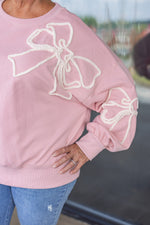 pink white stitched bow sweatshirt