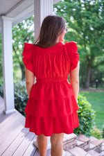 red tiered cocktail attire dress