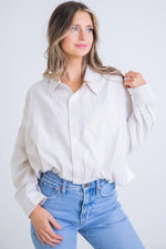 Karlie Tan and white striped button down seersucker bubble hem top