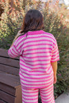 pink checkered sweater knit top