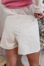 white faux leather pearl shorts