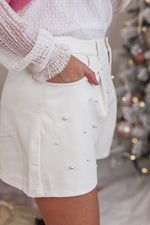 white faux leather pearl shorts